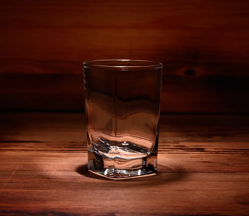 shot glass with wooden background